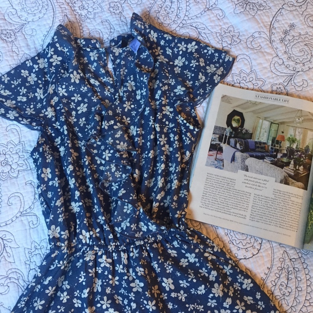 Blue and white floral romper with cap sleeves